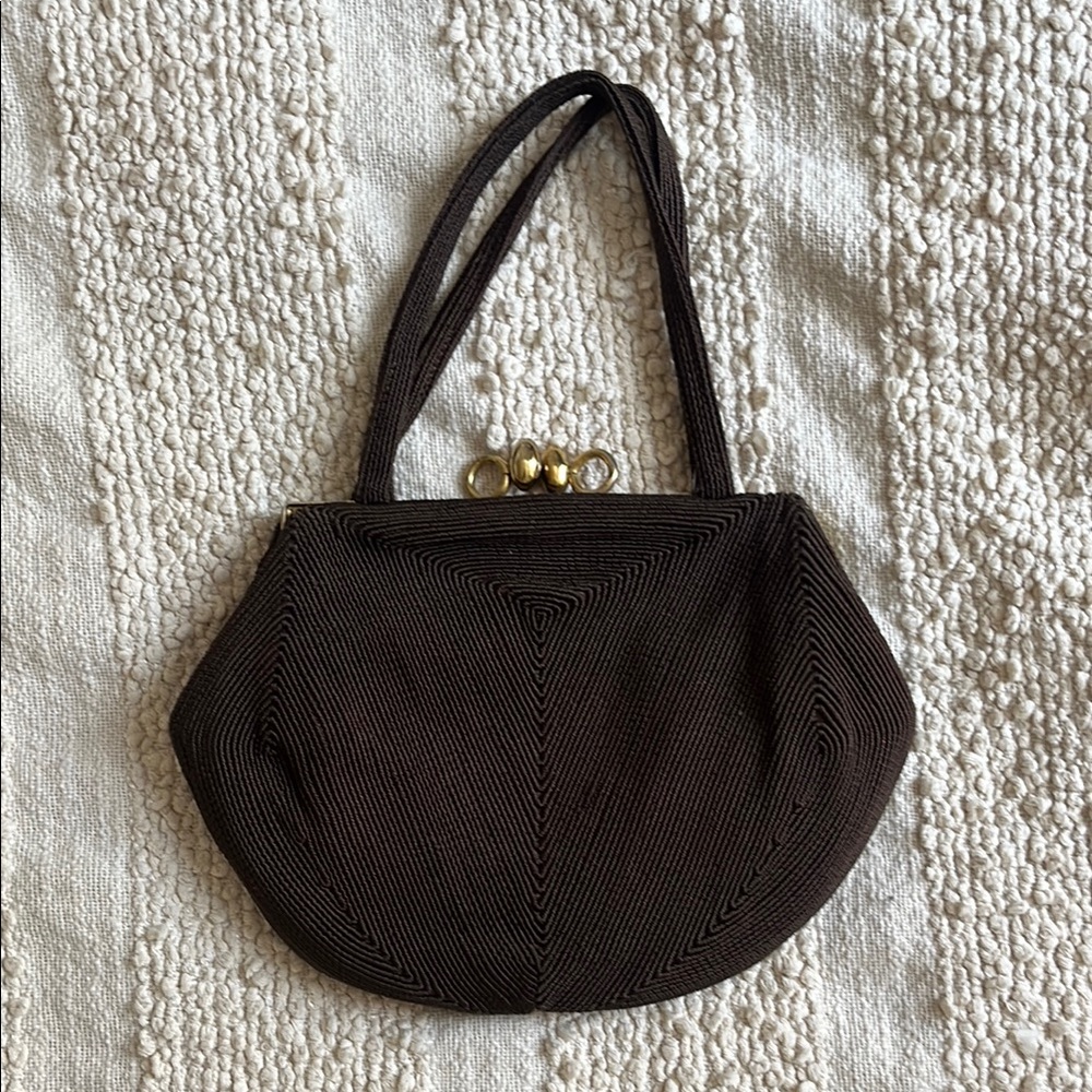 Elegant small brown vintage evening bag with gold hardware. Good condition.